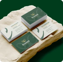 Cartes de visite vertes et dorées du cabinet Elsass Compta créées par Expert SA